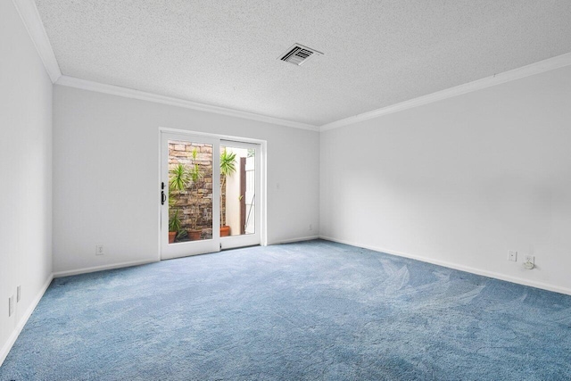 carpeted empty room with ornamental molding and a textured ceiling