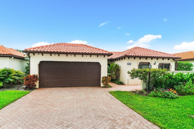 mediterranean / spanish-style house featuring a garage