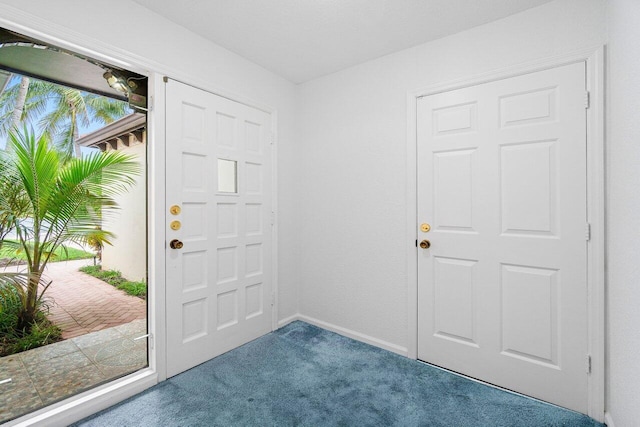 view of carpeted foyer