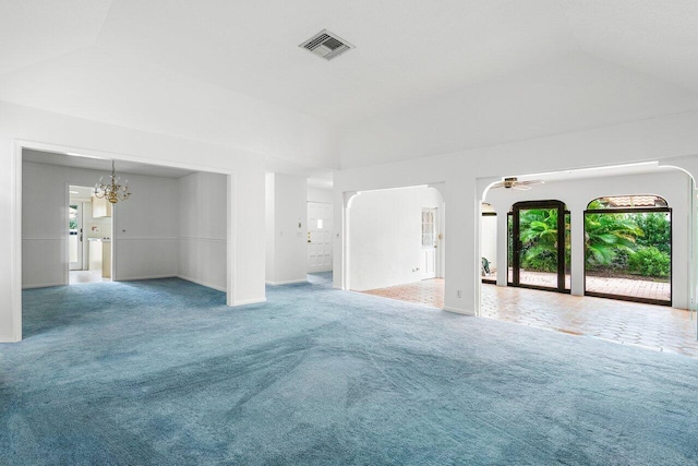 unfurnished living room with carpet flooring and ceiling fan with notable chandelier