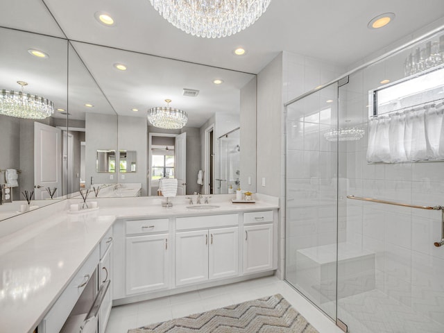 bathroom featuring vanity, walk in shower, and tile patterned floors