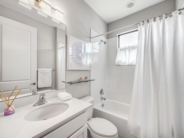 full bathroom featuring vanity, toilet, and shower / bath combo with shower curtain