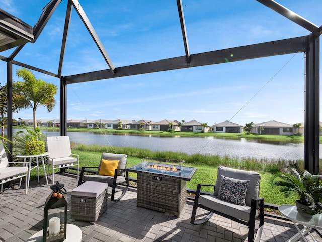 view of patio / terrace featuring a water view and a fire pit