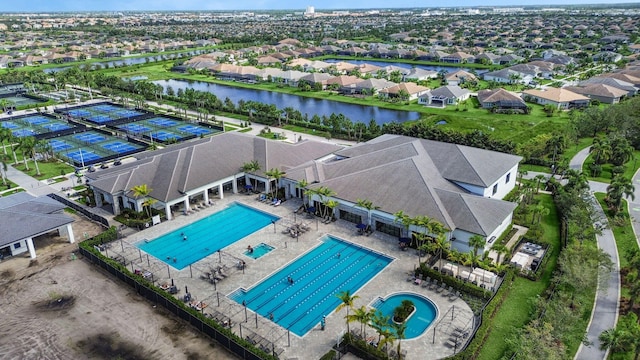 birds eye view of property with a water view