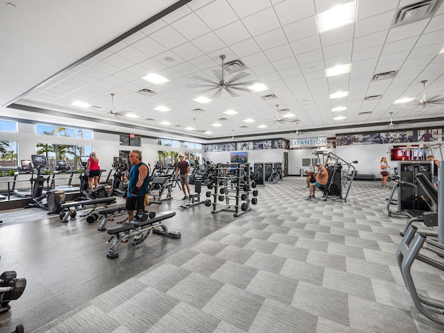 exercise room featuring a paneled ceiling