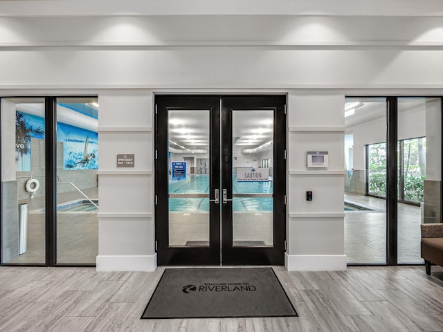 doorway to outside featuring french doors and hardwood / wood-style floors