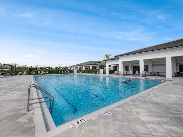 view of swimming pool featuring a patio