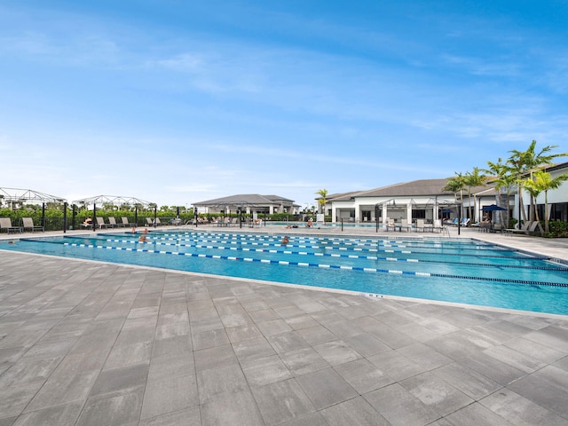 view of swimming pool featuring a patio area