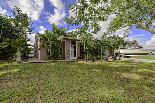 view of front of property with a front lawn