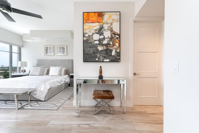 bedroom featuring ceiling fan and light hardwood / wood-style flooring