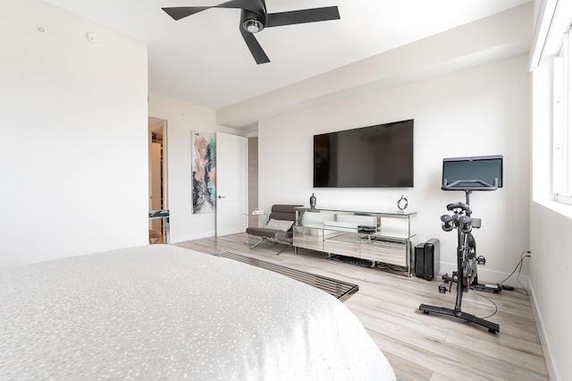 bedroom with ceiling fan and light wood-type flooring