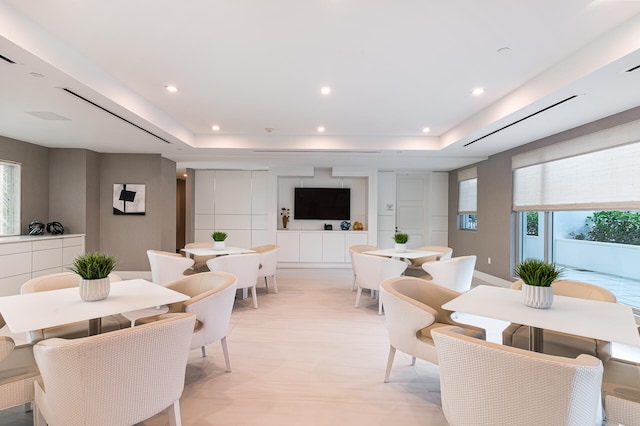 dining space featuring a tray ceiling