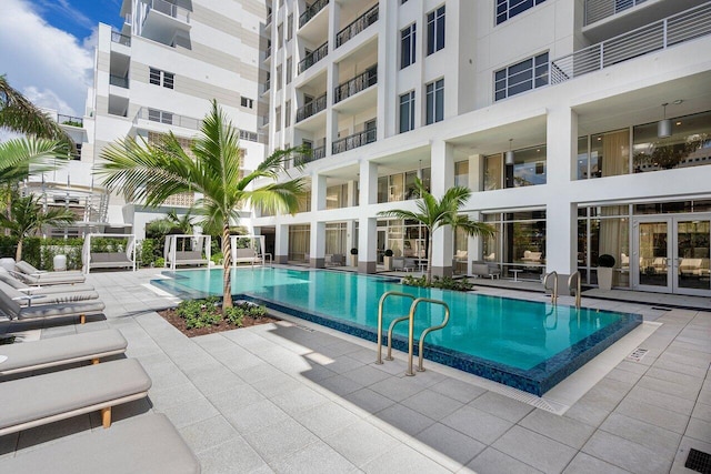 view of swimming pool with a patio