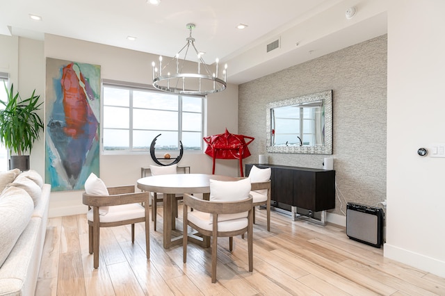 dining room featuring a chandelier and light hardwood / wood-style floors