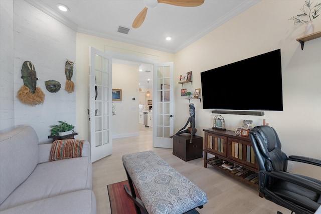 office space with light hardwood / wood-style floors, french doors, crown molding, and ceiling fan