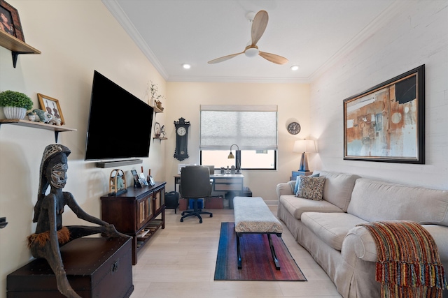 living room with crown molding, light hardwood / wood-style floors, and ceiling fan