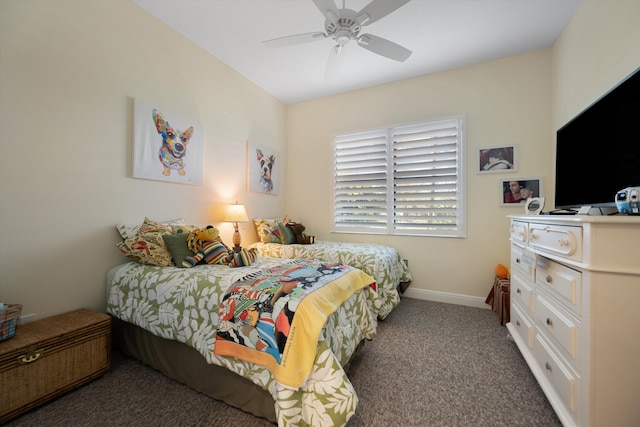 bedroom with ceiling fan and dark colored carpet