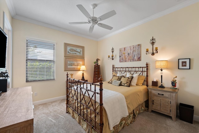 bedroom featuring light carpet, ornamental molding, and ceiling fan