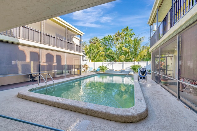 view of swimming pool featuring a patio