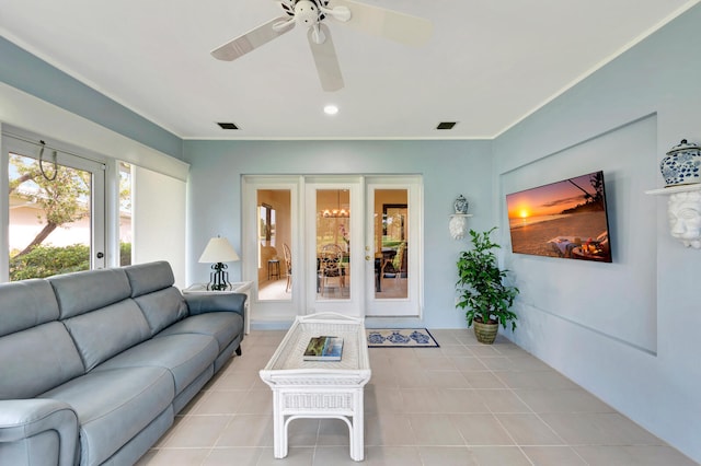 tiled living room with ceiling fan