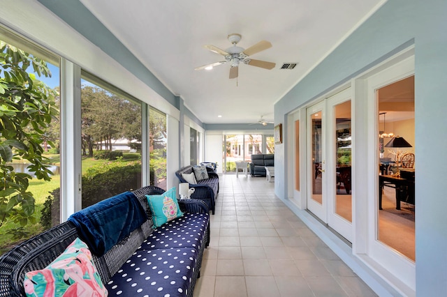 sunroom / solarium with ceiling fan