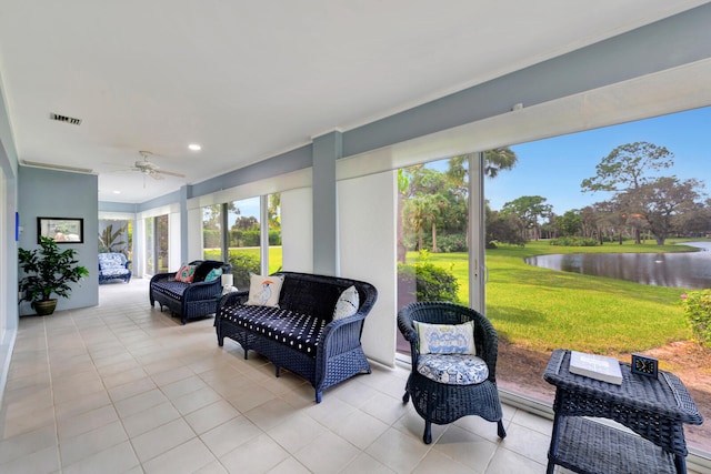 view of patio with outdoor lounge area, a water view, and ceiling fan