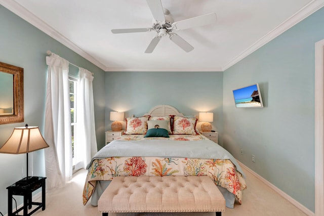 carpeted bedroom with ornamental molding and ceiling fan