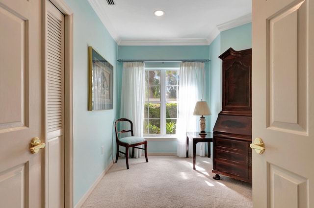 living area featuring light carpet and ornamental molding