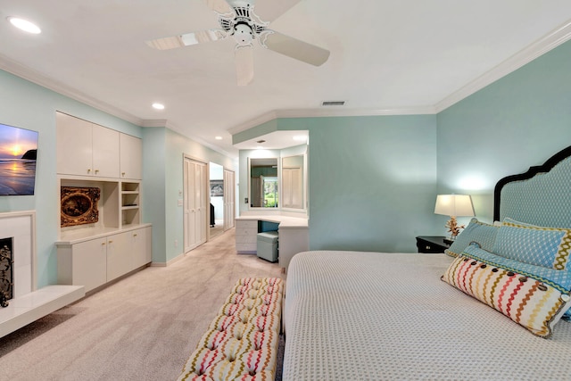 bedroom with ceiling fan, light carpet, and ornamental molding