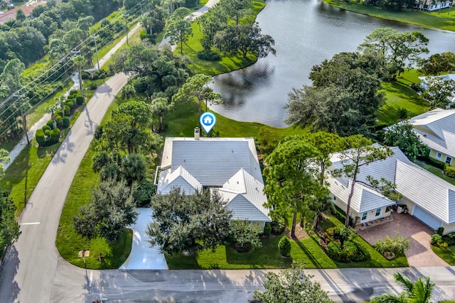 birds eye view of property with a water view