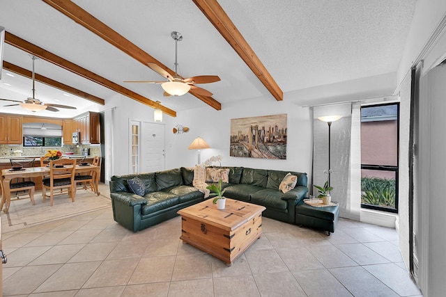 tiled living room featuring a textured ceiling and vaulted ceiling with beams