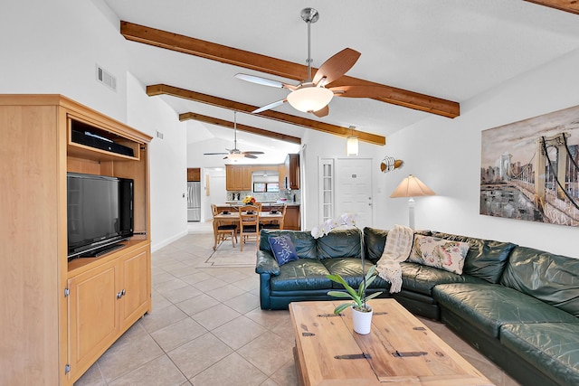 living room with light tile patterned floors, lofted ceiling with beams, visible vents, and a ceiling fan