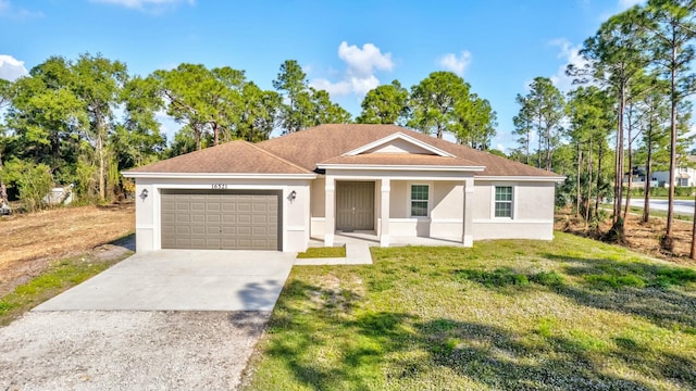 ranch-style house featuring a garage and a front lawn