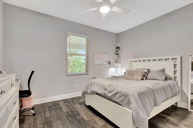 bedroom with ceiling fan and dark hardwood / wood-style flooring