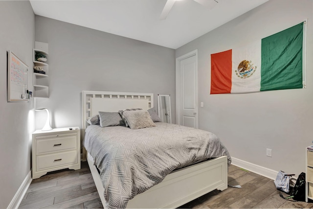 bedroom featuring ceiling fan and dark hardwood / wood-style flooring