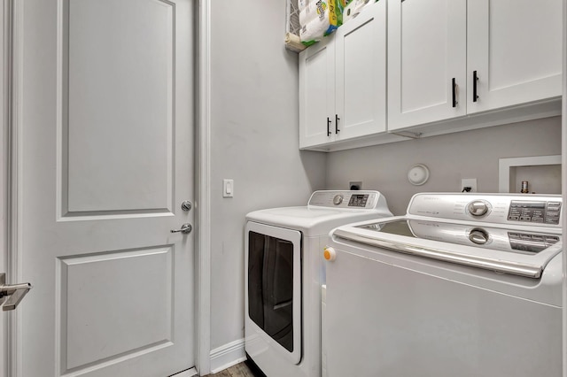 laundry area with cabinets and washer and dryer