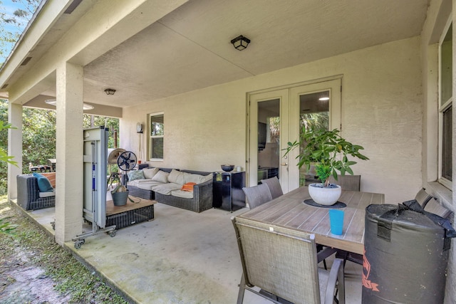 view of patio / terrace with an outdoor living space and french doors