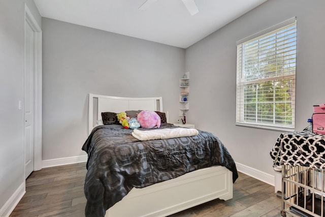 bedroom featuring hardwood / wood-style floors and ceiling fan