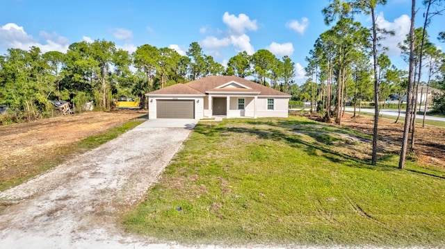 view of front of home with a garage and a front lawn