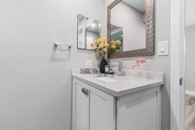 bathroom featuring hardwood / wood-style flooring and vanity