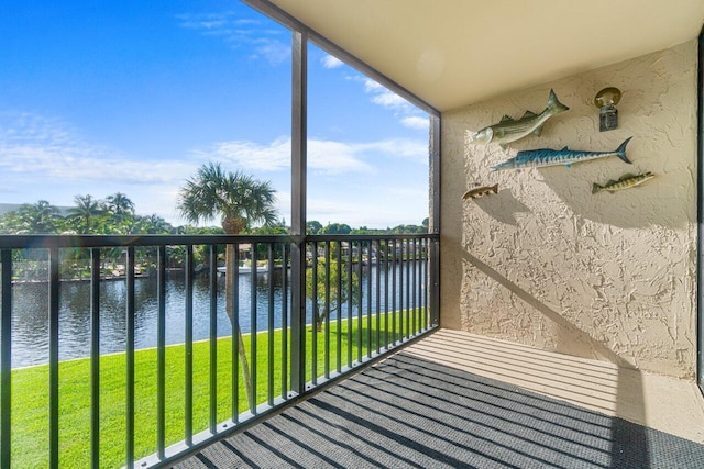 balcony featuring a water view