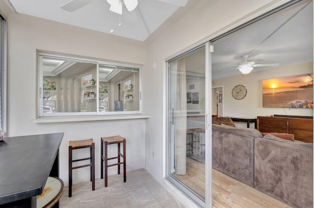 dining area with ornamental molding, light hardwood / wood-style floors, and ceiling fan