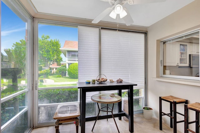 sunroom / solarium with ceiling fan