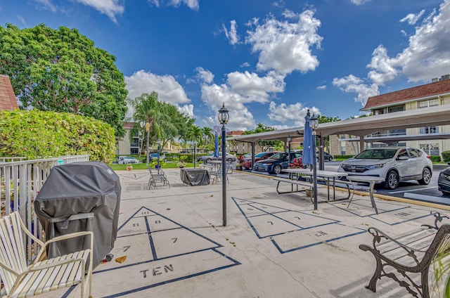 view of patio / terrace with a carport and grilling area