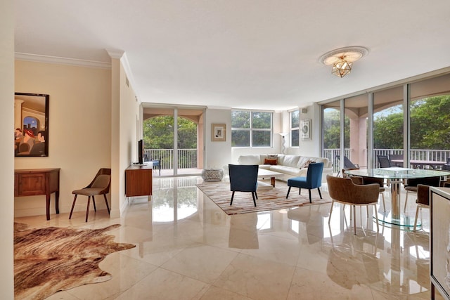 living room featuring crown molding and expansive windows