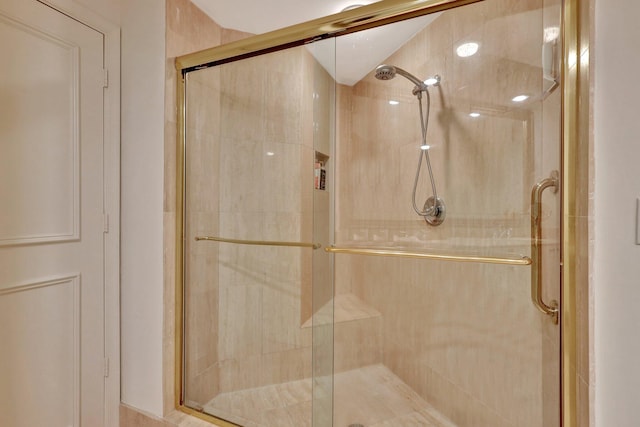 bathroom with a shower with shower door