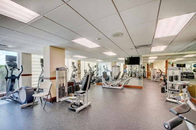 exercise room featuring a paneled ceiling