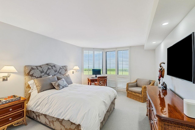 bedroom featuring light colored carpet