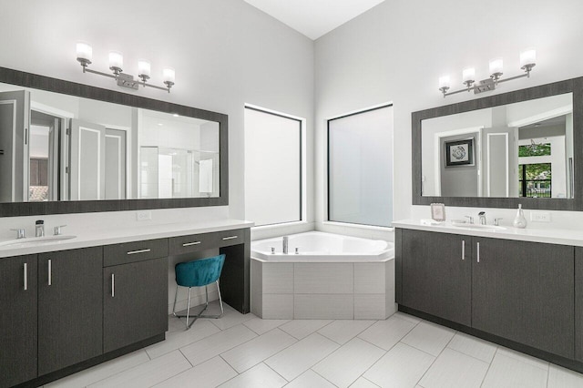 bathroom with vanity, shower with separate bathtub, and tile patterned floors