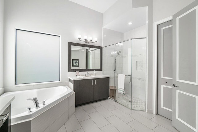 bathroom featuring vanity, tile patterned floors, and plus walk in shower